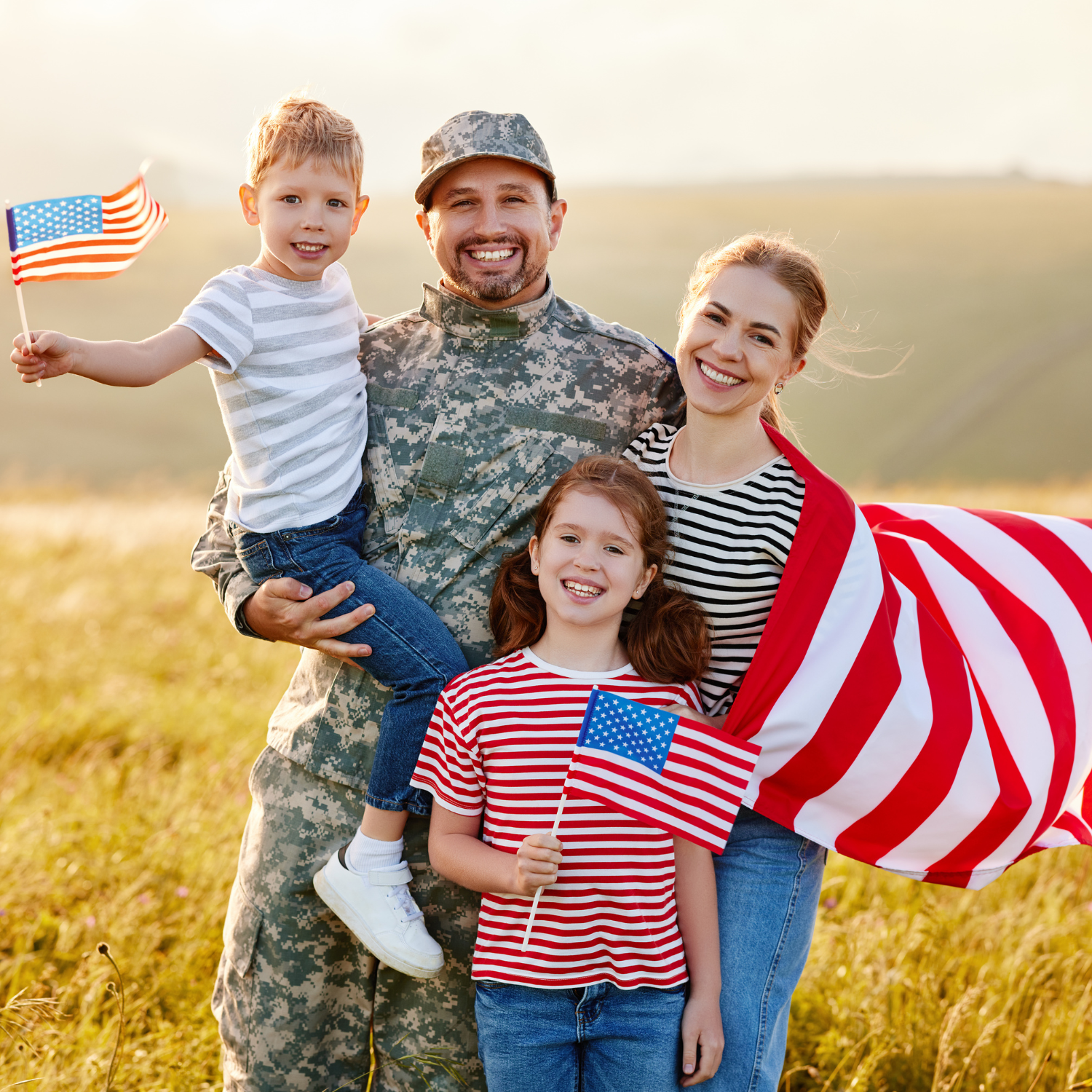 a military with his family holding a flag