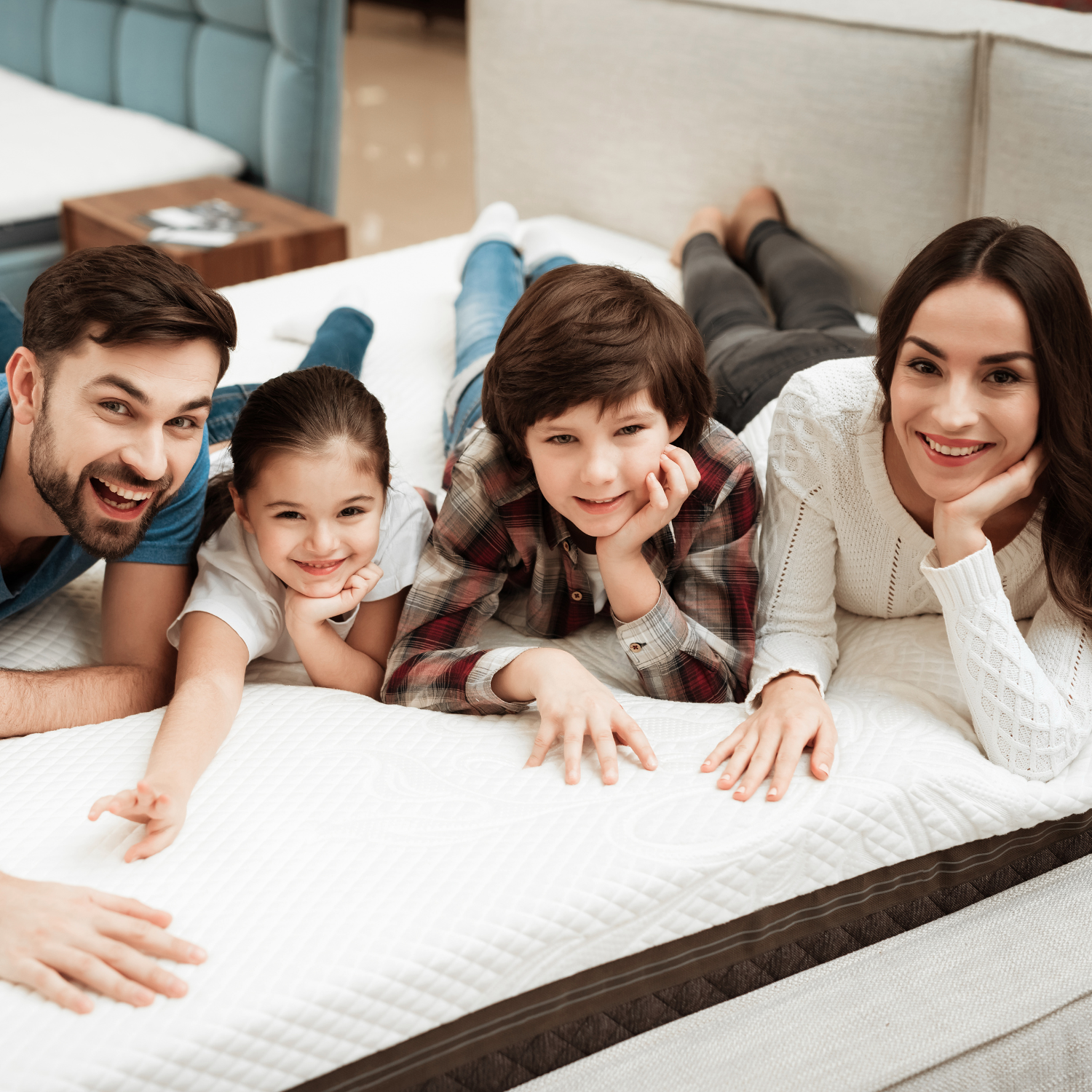 family lying on a mattress